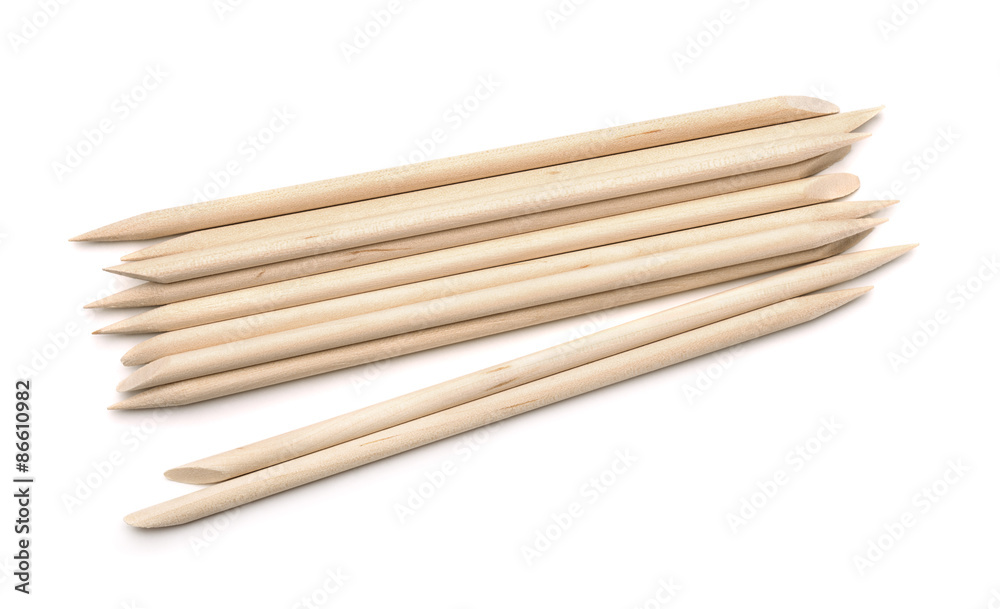 Orange wood stick cuticle pusher isolated on white Orange wood stick cuticle pusher isolated on white