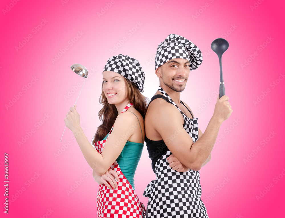 Pair of funny cooks against gradient Pair of funny cooks against gradient