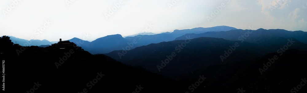 Beautiful panoramic bird-fly view to silhouettes of mountains, t