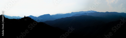 Fototapeta Naklejka Na Ścianę i Meble -  Beautiful panoramic bird-fly view to silhouettes of mountains, t