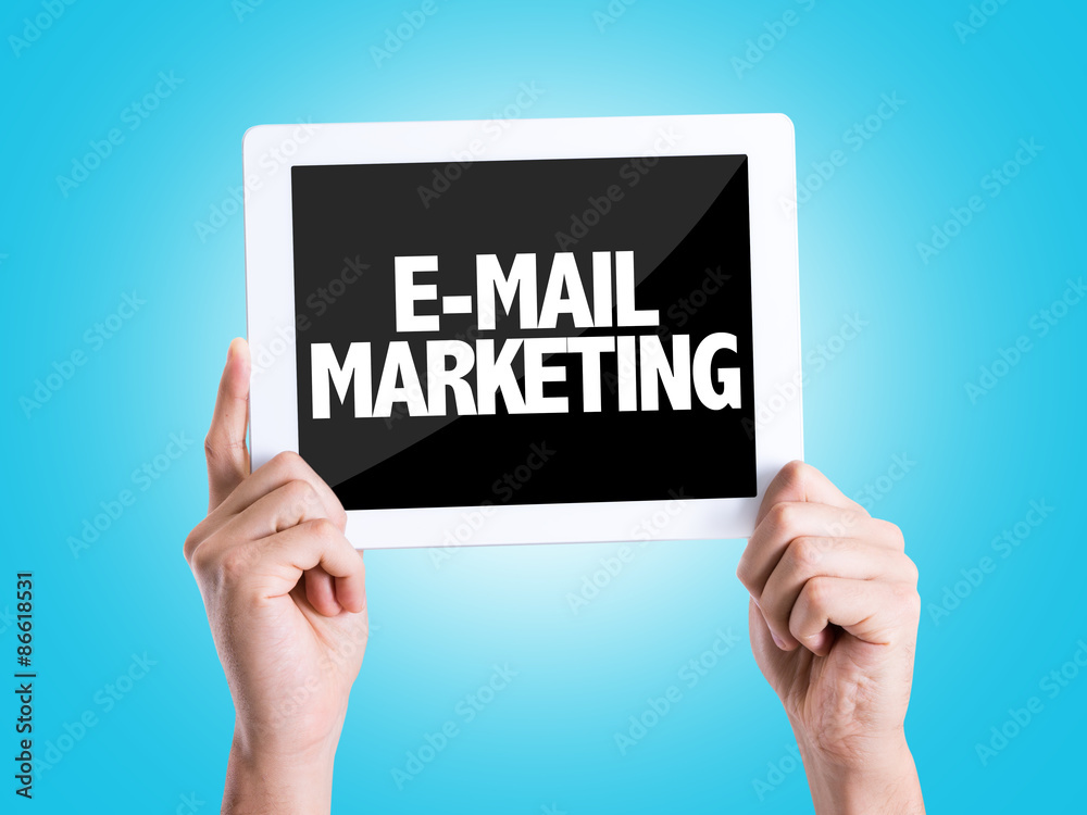 Tablet pc with text E-Mail Marketing with blue background Tablet pc with text E-Mail Marketing with blue background