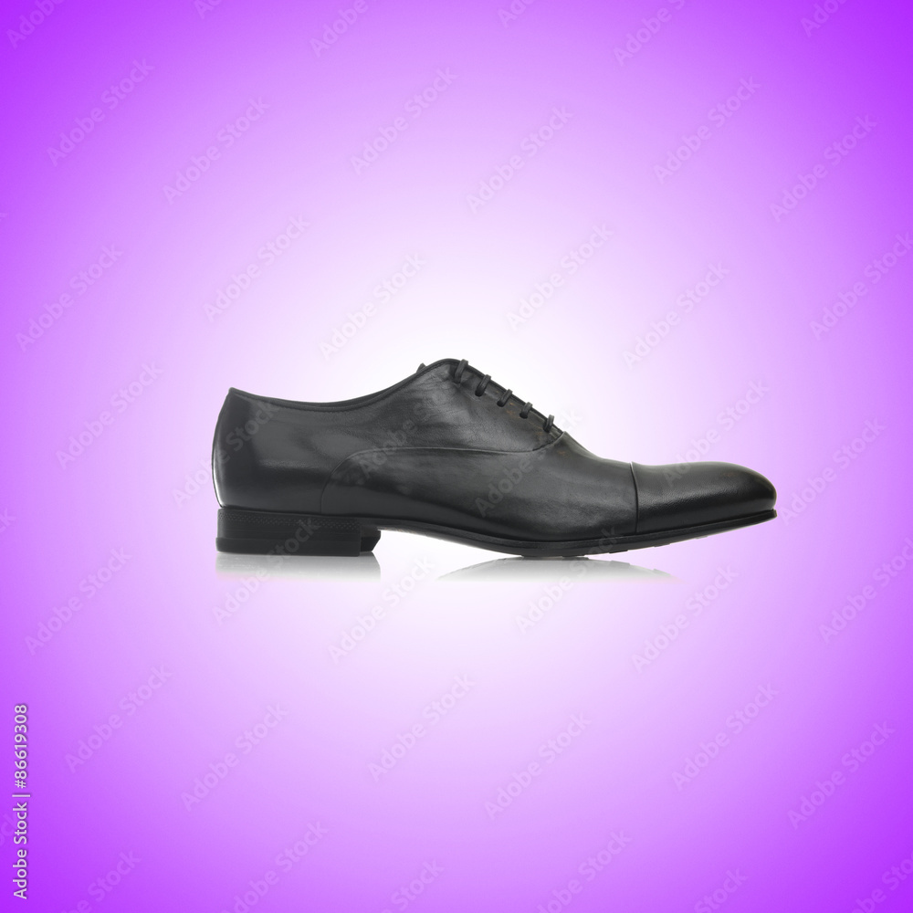 Fashion concept with male shoes against gradient 