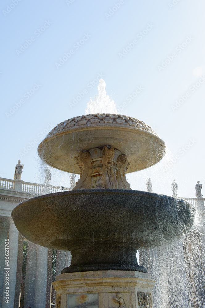 Fountain in St Peter square with colonnade in background, Vatican City