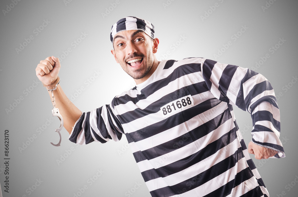 Convict criminal in striped uniform Convict criminal in striped uniform