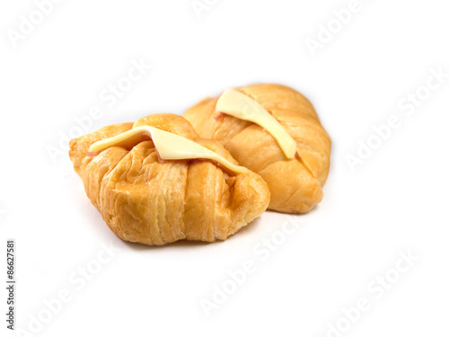 Croissant with ham and cheese isolated on white background