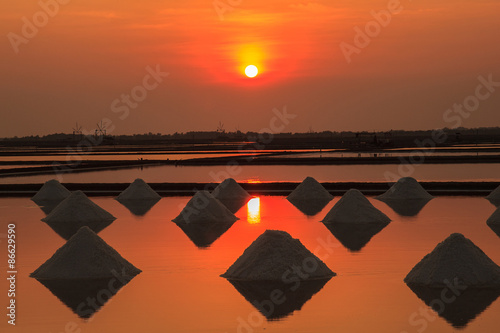 Sunset in Salt farming at the coastal Phetchaburi provinces of Thailand, Edit warm tone. © Southtownboy Studio