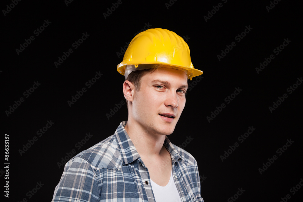 portrait of a worker with yellow helmet on head portrait of a worker with yellow helmet on head