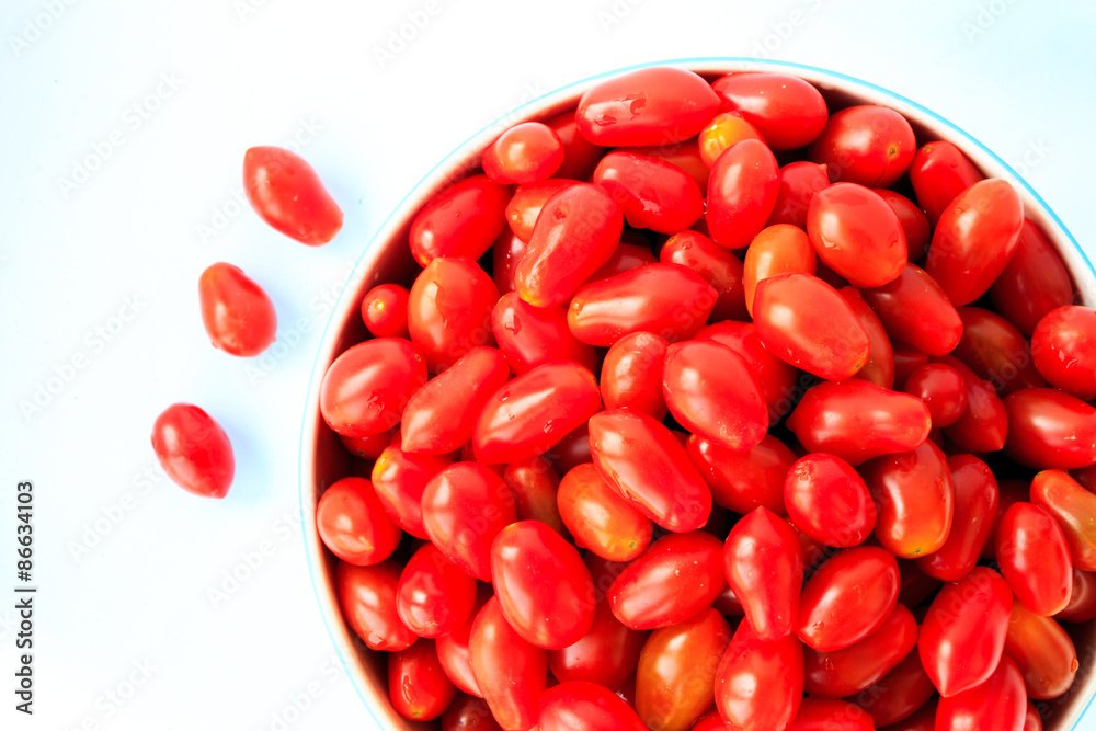 Group of tomatoes in bowl on white background Group of tomatoes in bowl on white background