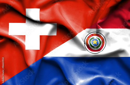 Waving flag of Paraguay and Switzerland