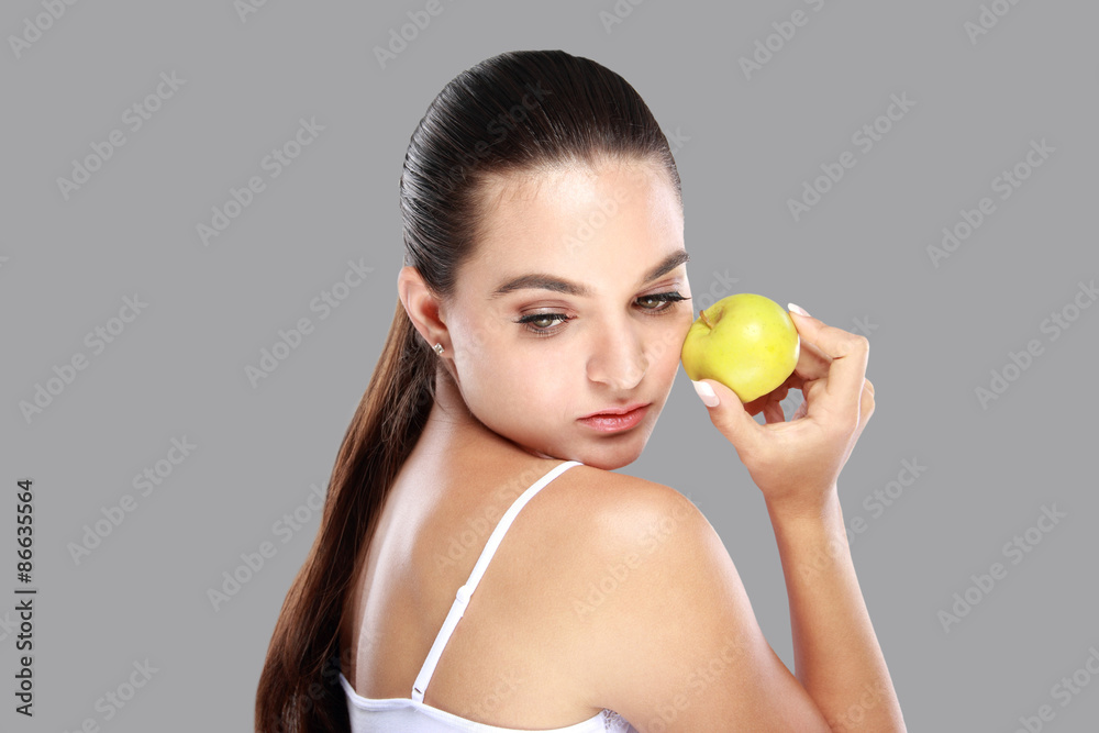 beautiful caucasian woman with an apple in her hand beautiful caucasian woman with an apple in her hand
