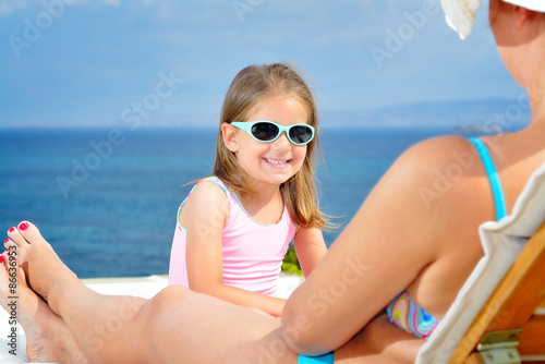 Adorable girl on sunbed