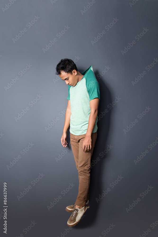 young man floating with his hanged shirt Stock-Foto | Adobe Stock