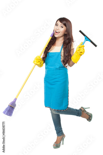 Young asian woman happily doing chores, isolated