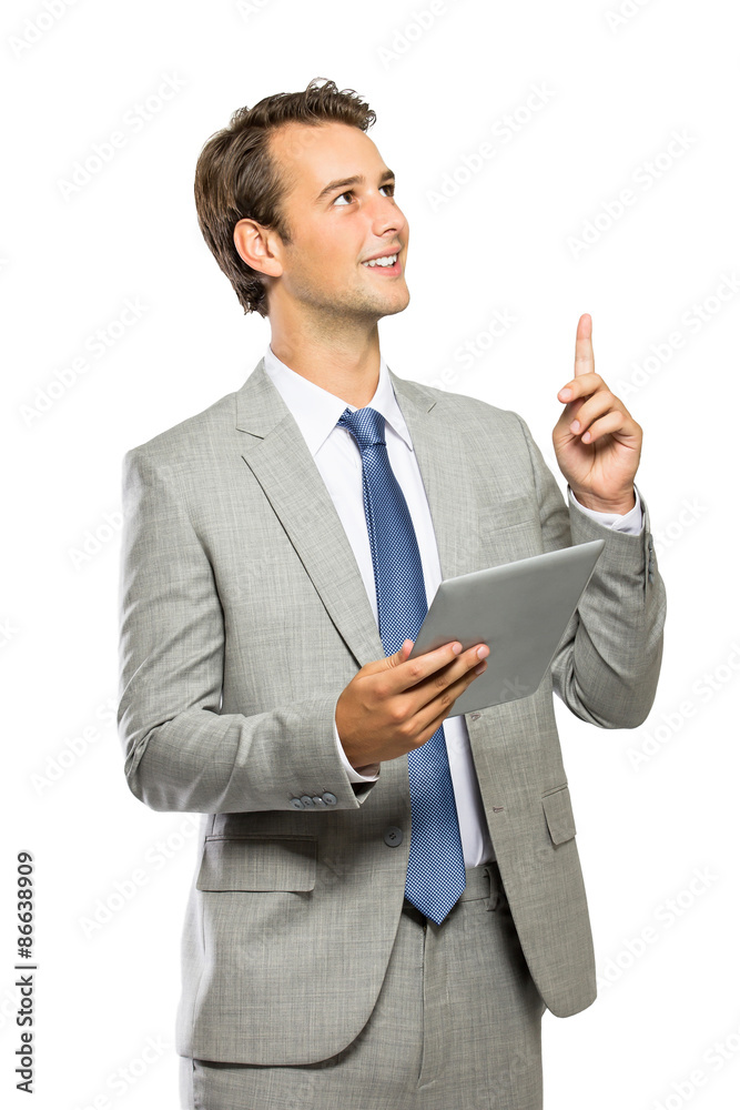 young businessman got an idea after reading an article on tablet young businessman got an idea after reading an article on tablet