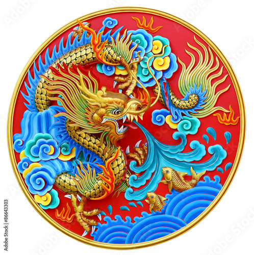 Chinese dragon statue with red background on the temple wall clipping path.