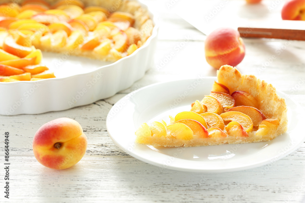 Slice of apricot pie on white wooden background Slice of apricot pie on white wooden background