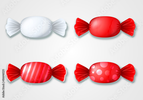Set of colored candies in wrappers - red and white.