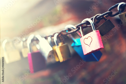 Series of colored padlocks with hart shape photo