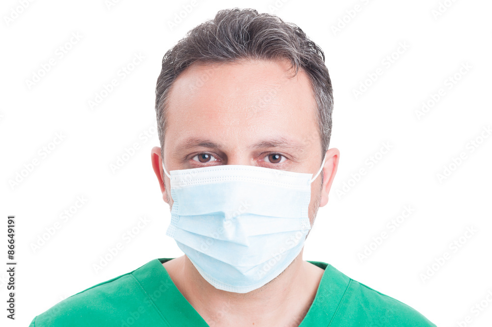 Headshot or portrait of a man doctor wearing surgeon mask
