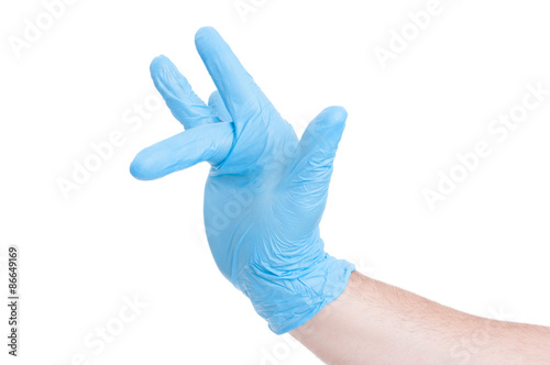 Fototapeta Naklejka Na Ścianę i Meble -  Gynecologist hand making finger insert gesture