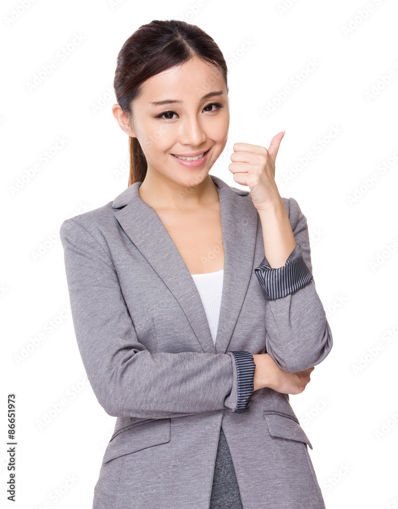 Young businesswoman showing thumb up Young businesswoman showing thumb up