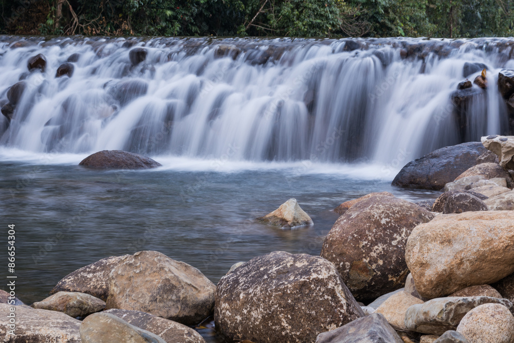 Obraz premium Dam handmade with stones A small river 