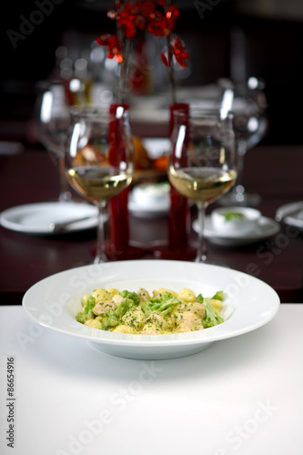 Gnocchi with broccoli in white sauce, shallow depth of field