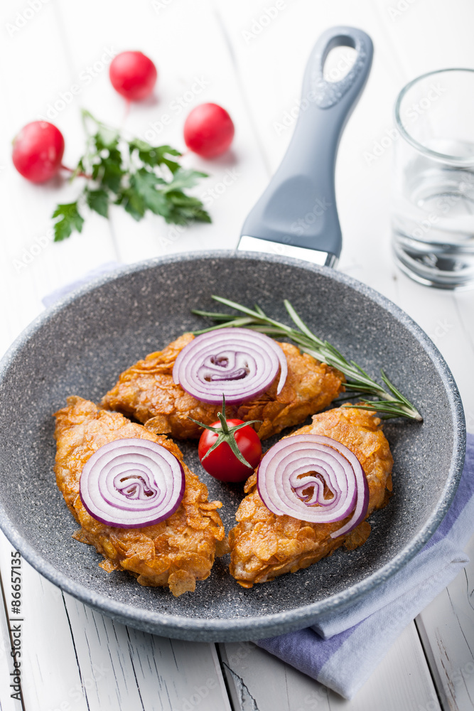 Chicken cutlets in corn flakes