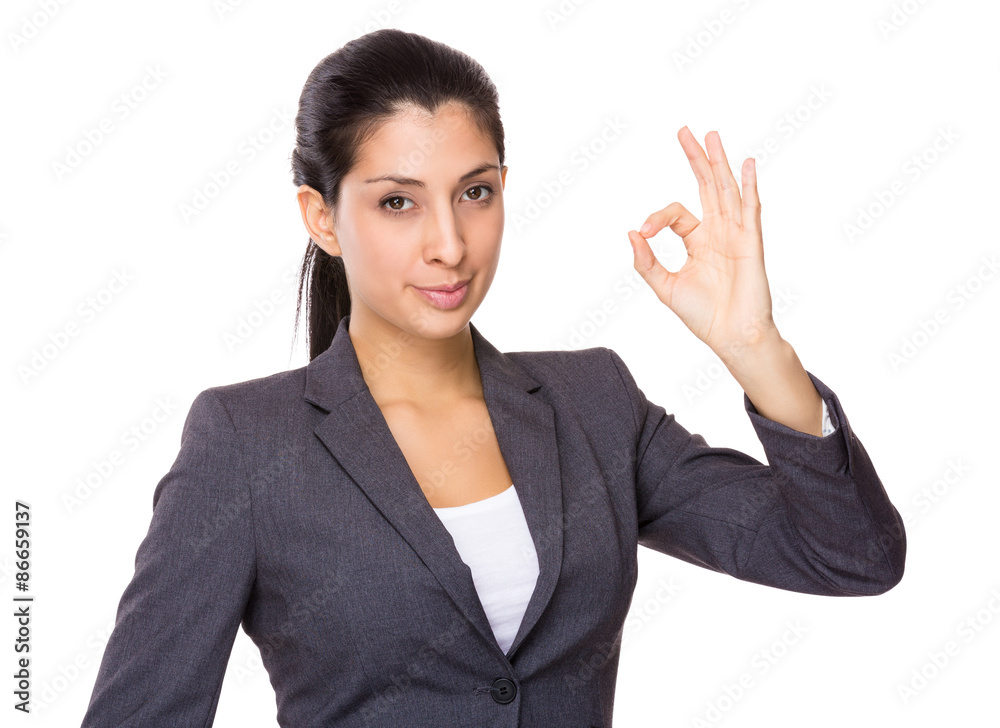 Indian businesswoman with ok sign gesture Indian businesswoman with ok sign gesture