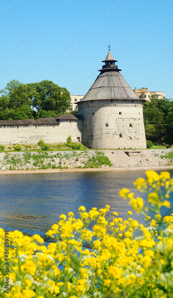 Russia, Pskov. View of the Pokrovskaya tower from the opposite side of the Velikaya river