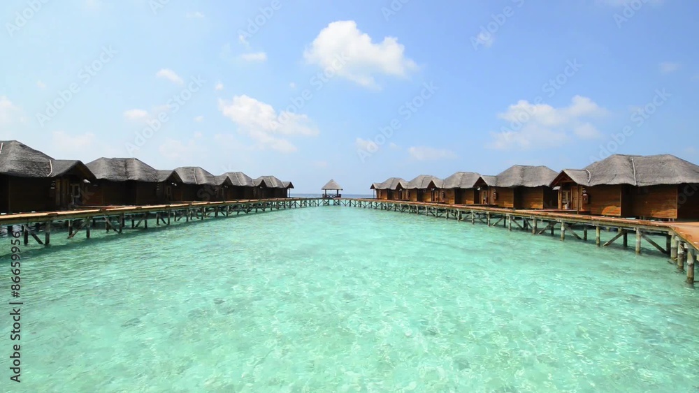 Over water bungalows with steps into amazing green lagoon Over water bungalows with steps into amazing green lagoon