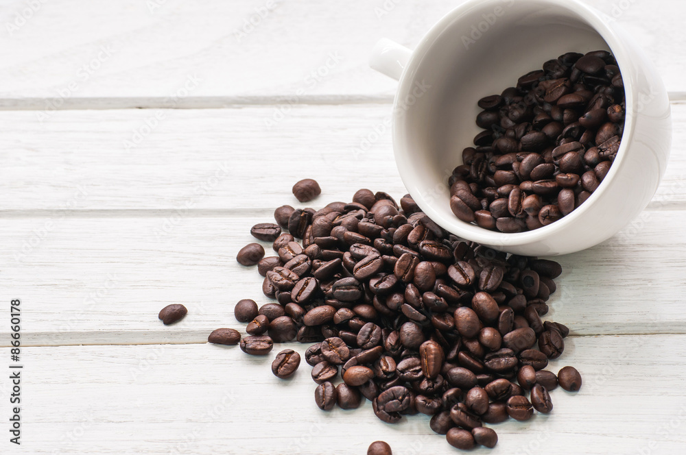 coffee beans and cup on white wood coffee beans and cup on white wood