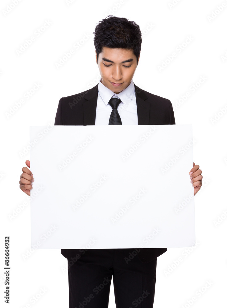 Businessman holding a placard Businessman holding a placard