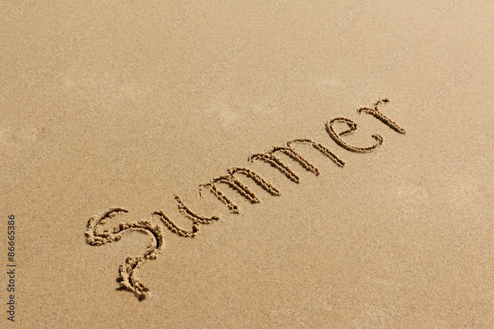 Summer - text written by hand on sand on a beach Summer - text written by hand on sand on a beach