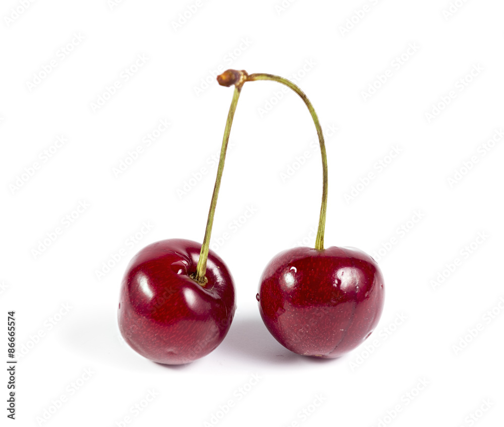A pair of ripe cherries isolated on white A pair of ripe cherries isolated on white