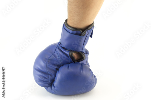Mans hand in blue boxing glove isolated