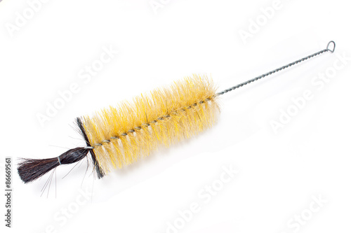 Black and yellow dish washing brush isolated on white