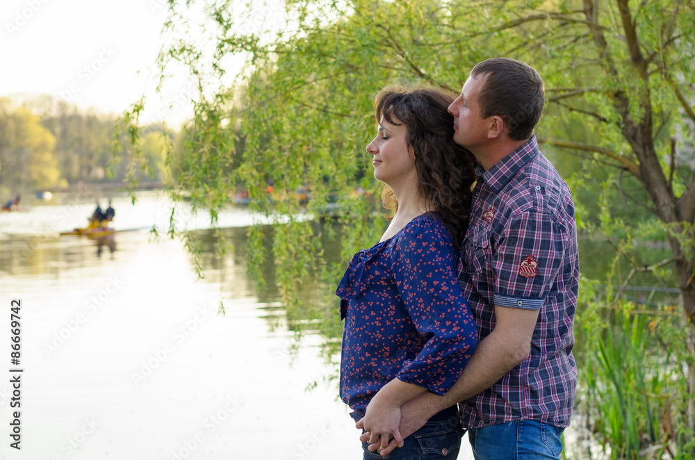 family dad mother and daughter on a walk on nature