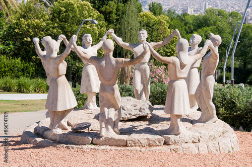 Sardana dancers statue in Barcelona Spain