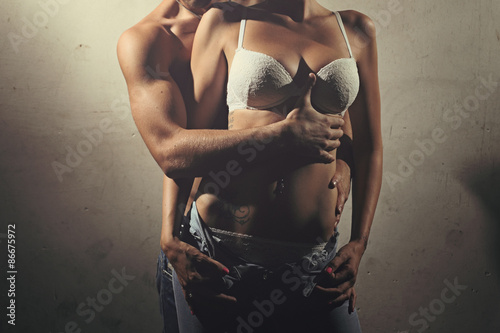 Detail of man and woman torso