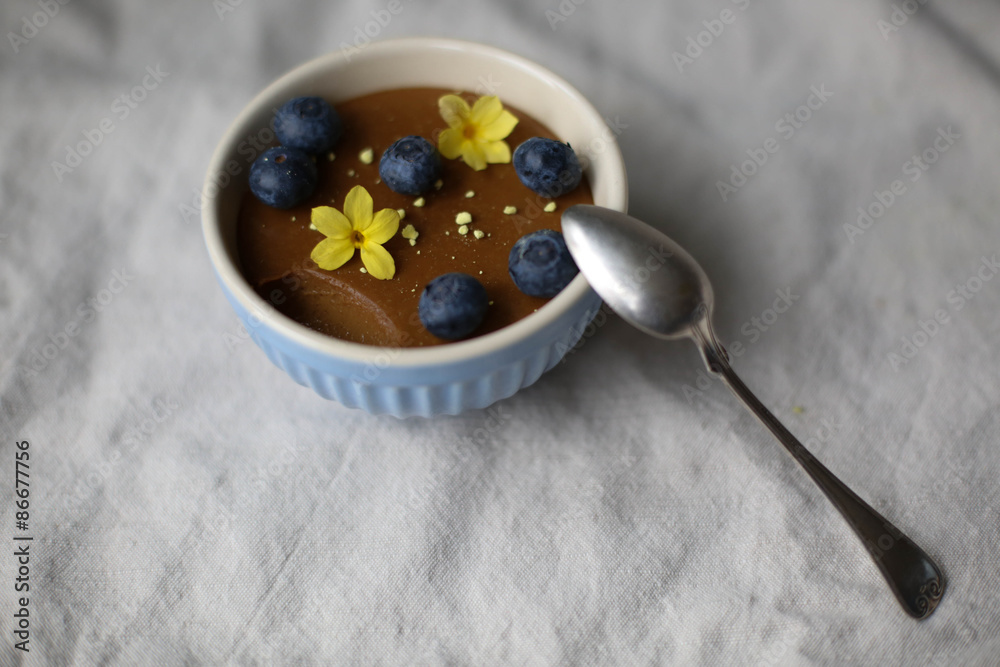 Fototapeta premium Liquorice Pannacotta with Berries and Crushed Meringues