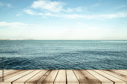 Wood  blue sea and sky background