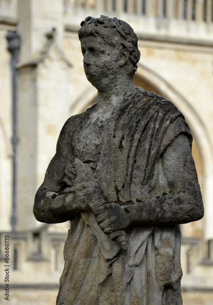 Naklejka premium Old statues from Bath and background 