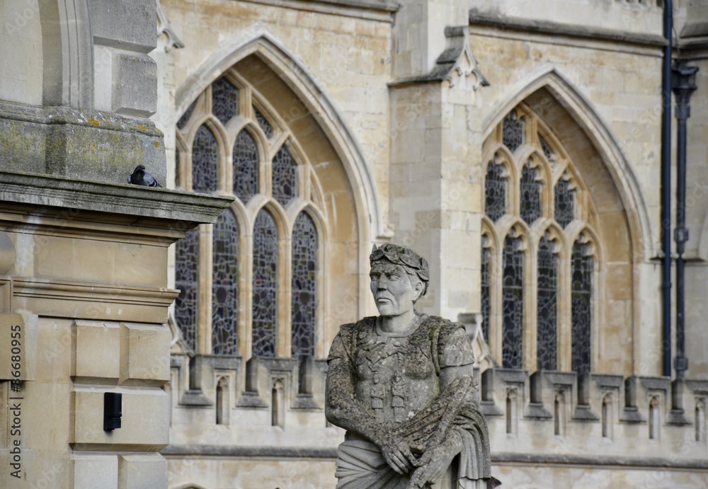 Old statues from Bath and background 