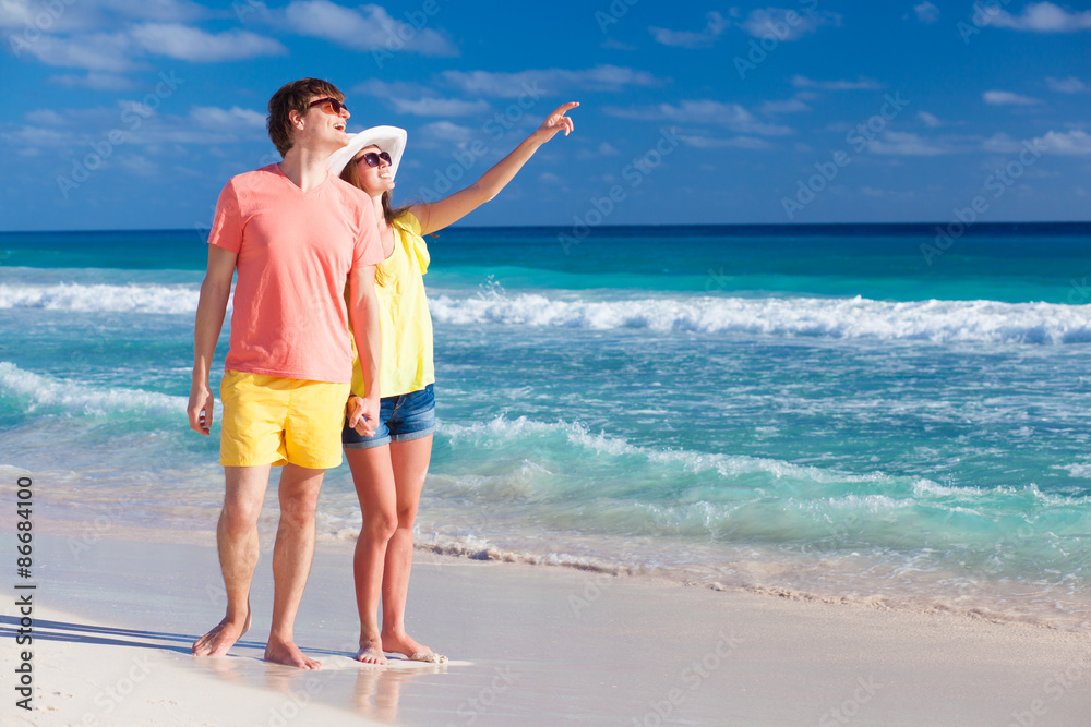 happy romantic young couple pointing at the sky happy romantic young couple pointing at the sky