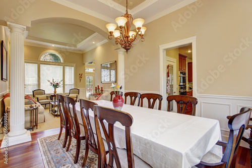 Dinning room with large table and lots of chairs.