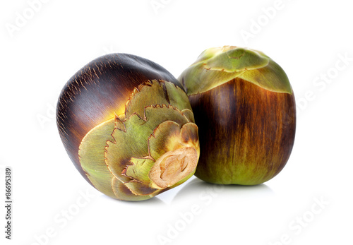 whole fresh toddy palm fruit on white background