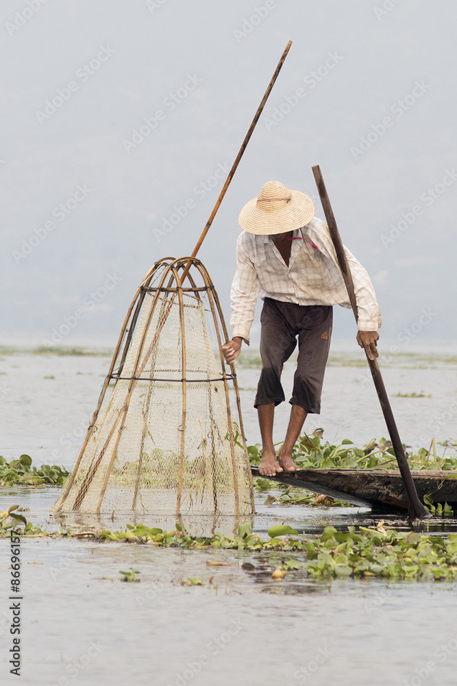 Intha fisherman on Inle Lake uses handmade conical reed net.Inle Lake,Myanmar