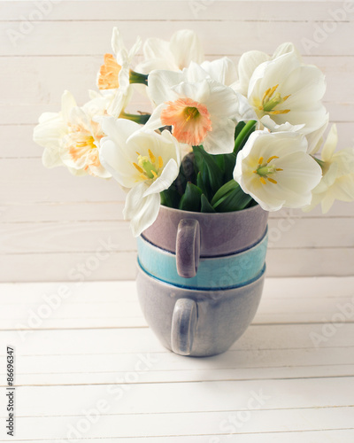 Fresh narcissus  and tulips in vase