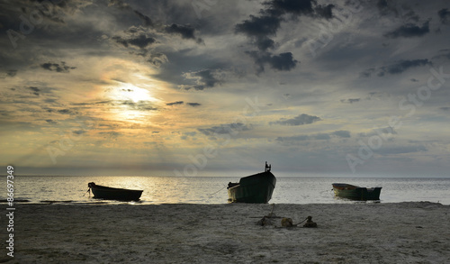 Coastal landscape with anchored fishing boats